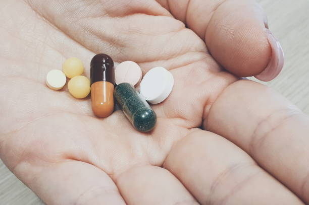 istock taking pills to treat colds and various diseases 1168914498