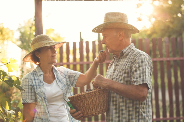 istock Woman feeding man with grape 1168914682