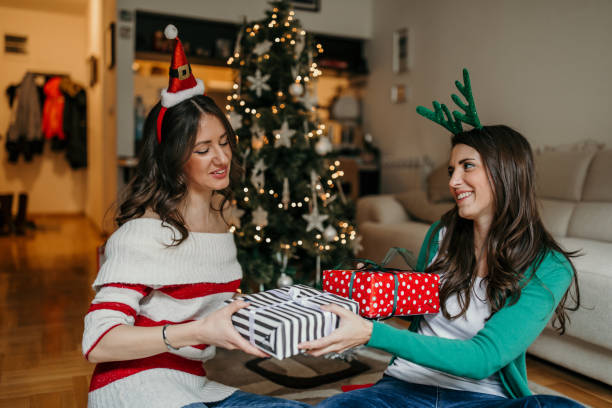 istock Two beautiful young women celebrating New Year 1168914860