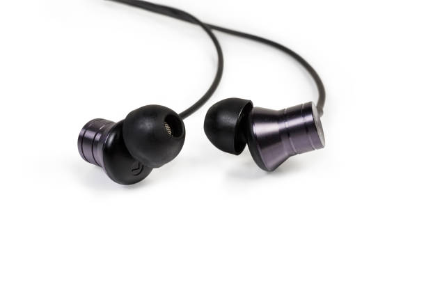 istock Black in-ear earphones close-up on a white background 1168915847