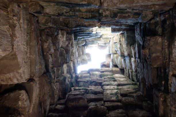 istock Deep ancient well. Masonry. Light at the end of the tunnel. Background. 1168915895