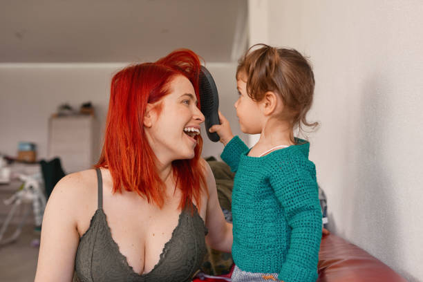 istock Combing my mom's hair 1168916382