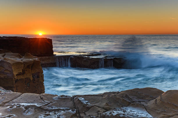 istock Clear Skies and Rocky Coastal Sunrise 1168918252