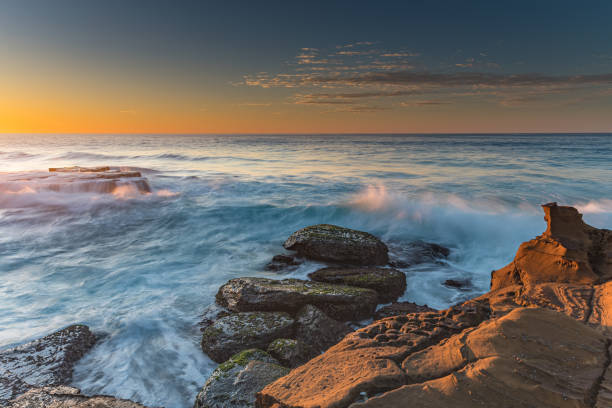 istock Clear Skies and Rocky Coastal Sunrise 1168918407