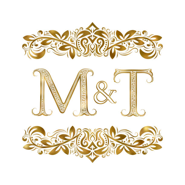 illustrazioni stock, clip art, cartoni animati e icone di tendenza di simbolo iniziali vintage m e t. le lettere sono circondate da elementi ornamentali. monogramma di partner matrimoni o commerciali in stile reale. - letter t letter a ornate alphabet