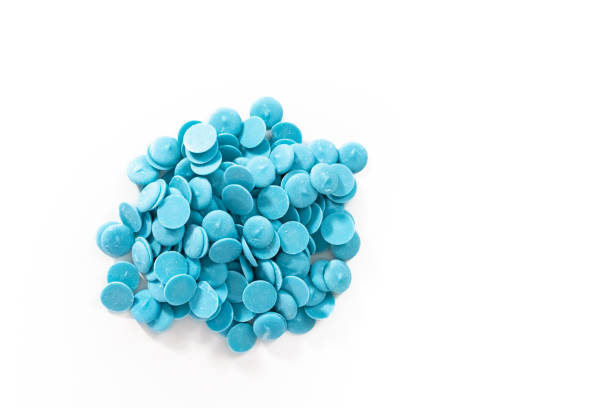 istock Blue round chocolate chips for melting chocolate shapes 1168925135