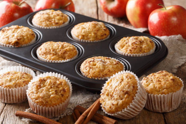 istock Golden muffins made from fresh apples with cinnamon close-up in a baking dish. horizontal 1168928387