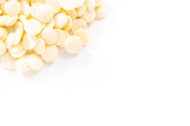 istock White round chocolate chips for melting chocolate shapes 1168928828
