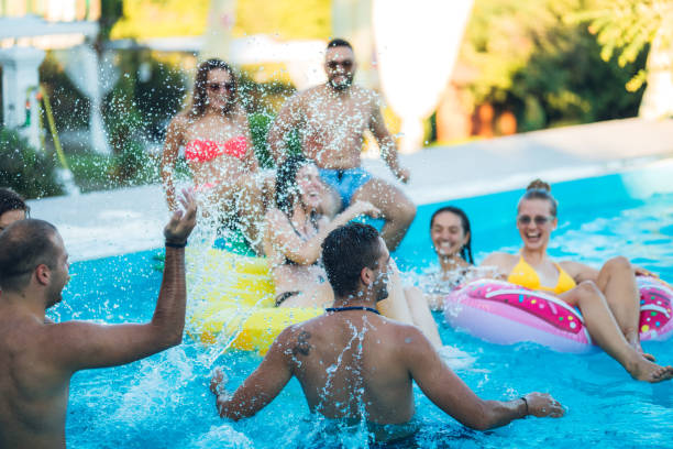 istock Friends at a poolside party 1168934541