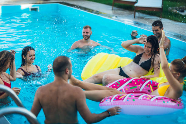 istock Friends at a poolside party 1168935775