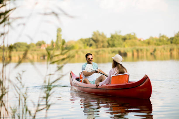 istock Loving couple rowing on the lake 1168936255