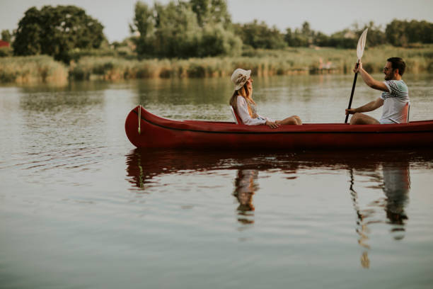 istock Loving couple rowing on the lake 1168936264
