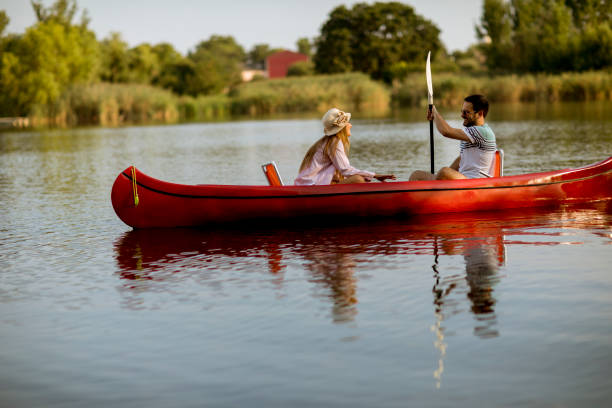 istock Loving couple rowing on the lake 1168936265