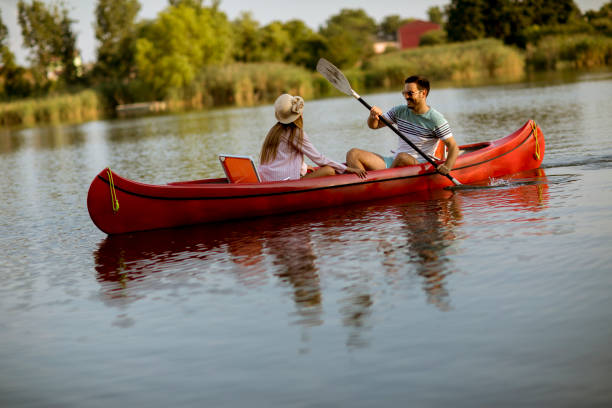 istock Loving couple rowing on the lake 1168936267