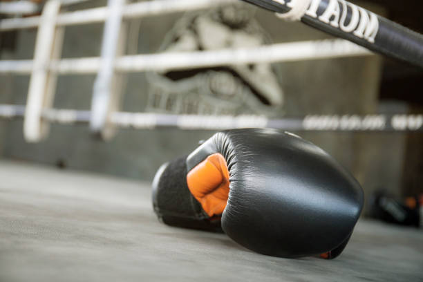 istock Gloves boxing on floor the ring. 1168937317
