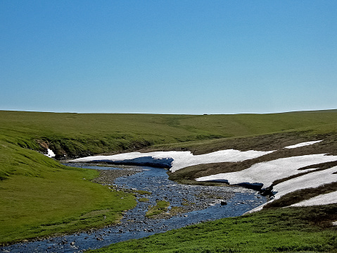 Melting snow in the spring. The spring heat will melt the snow. Brooks and streams of melt water
