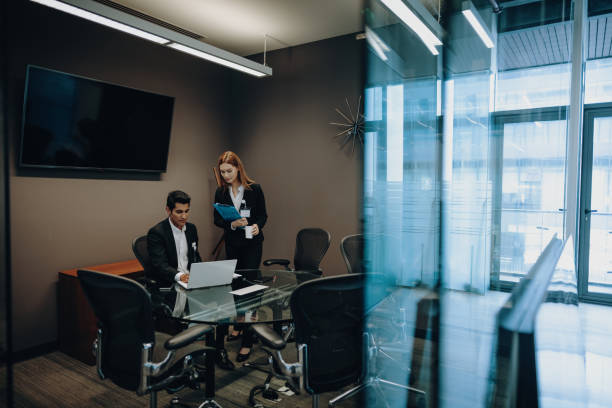 istock Cuban and Mexican business people using internet for business correspondence and analysis. 1168938439