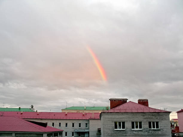 Rainbow over the city. Natural phenomenon is a rainbow