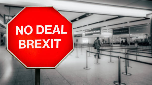 istock No Deal Brexit digital composite with passengers arriving at passport control within generic EU airport 1168940972