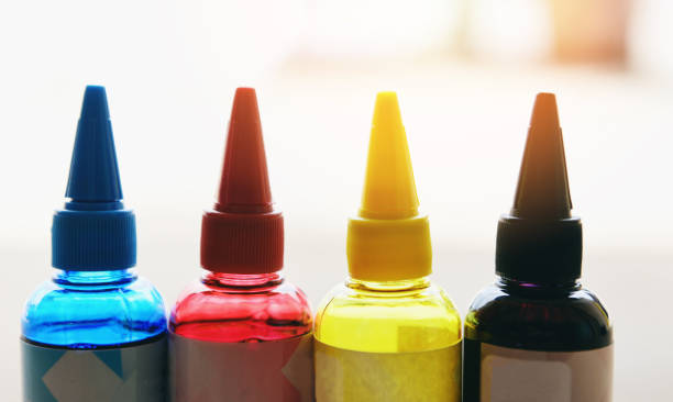istock CMYK ink bottle for printer machine - Colorful Ink refill set with cyan blue red magenta yellow and black for printer inks tank 1168942159