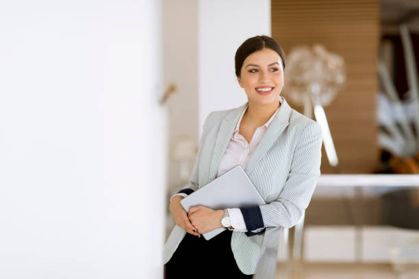 istock Young woman with a tablet in the office 1168943491