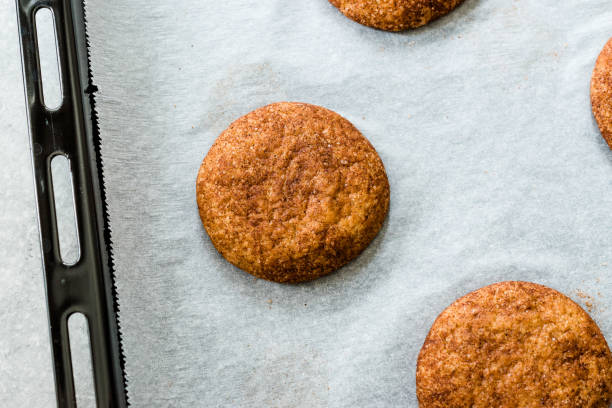 istock Cinnamon Cookies Snickerdoodle on Baking Paper with Oven Tray. 1168944605