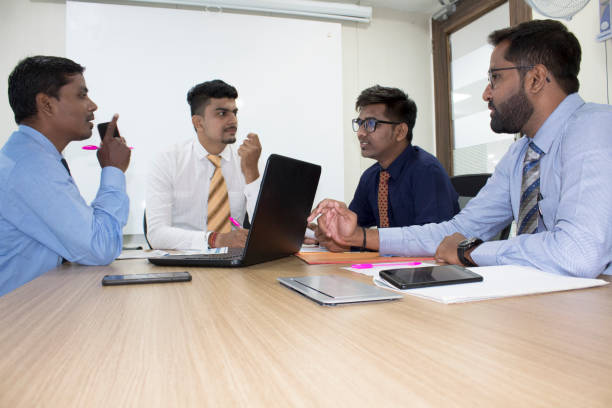 istock Business team discussing in boardroom meeting 1168944670