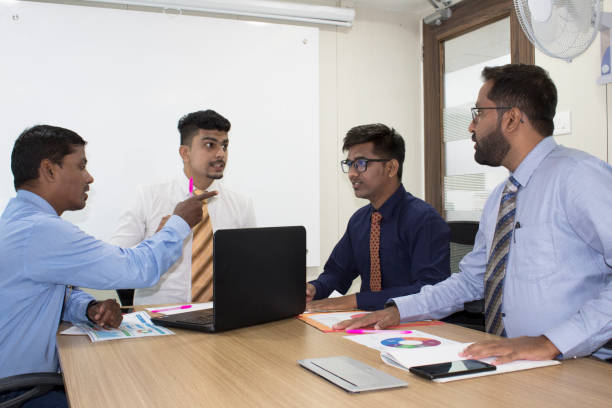 istock Business team discussing in boardroom meeting 1168945026