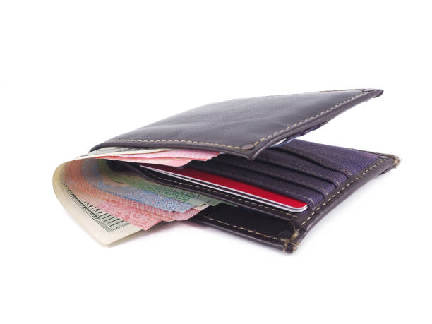 istock Brown wallet with money isolated on white background. 1168945767