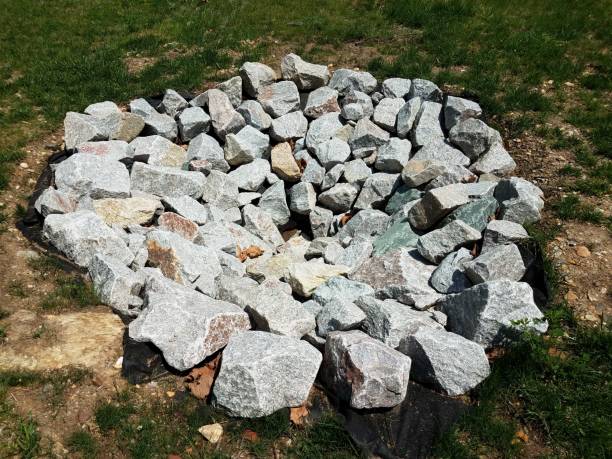 istock grey rocks or stones or boulders in circular formation on grass 1168946363