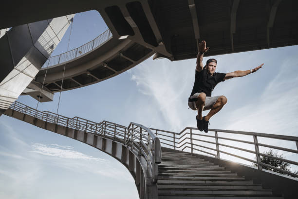 istock Man doing parkour in city 1168946587