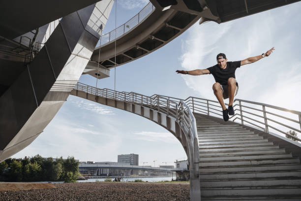 istock Parkour athlete doing a beautiful high jump from the stairs 1168946604