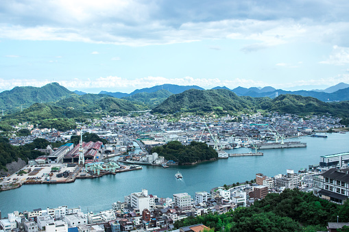 Cityscape of Onomichi from hill in cloudy day, Hiroshima, Japan. Onomichi city is well known for being featured in the 1953 film Tokyo Story nowadays.