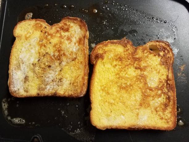 istock French toast bread with egg and cinnamon cooking on grill 1168947820