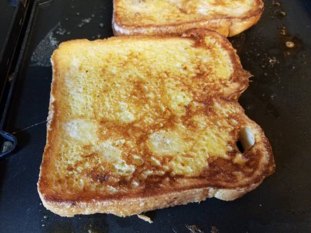 istock French toast bread with egg and cinnamon cooking on grill 1168947833