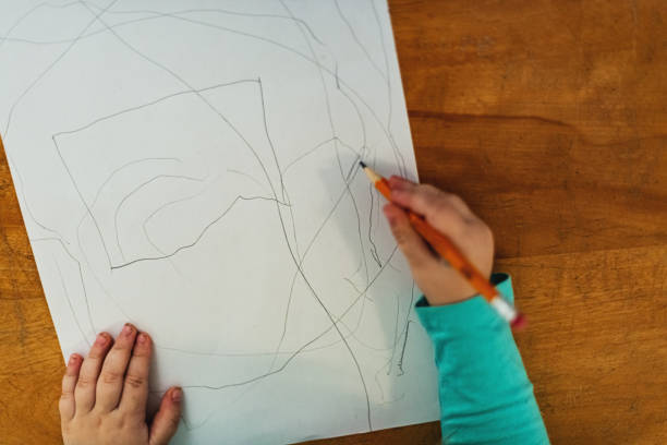 istock Girl Playing with Pencil 1168948985