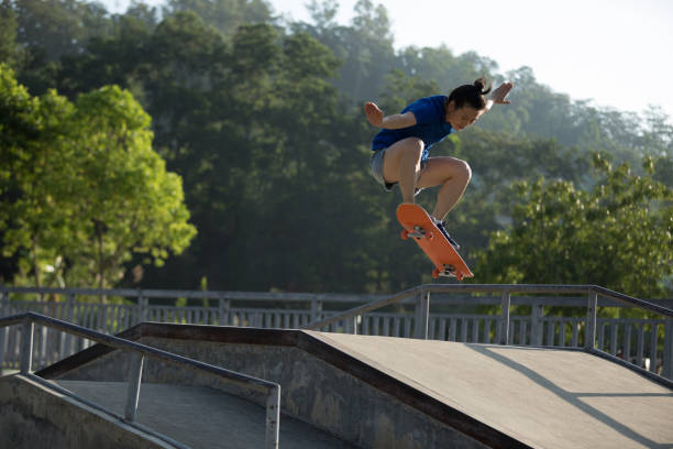 istock Skateboarder skateboarding at skatepark ramp 1168950605