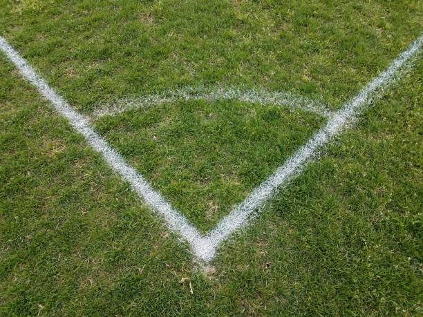 istock painted white lines on green grass or lawn 1168950995