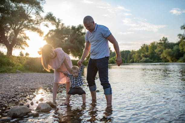 istock Young happy family in the park 1168951789