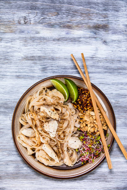 istock Pad thai - chicken meat with noodles and vegetables 1168952072