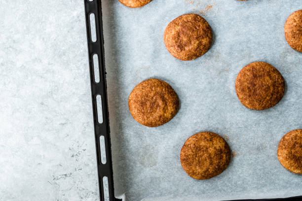 istock Cinnamon Cookies Snickerdoodle on Baking Paper with Oven Tray. 1168952146