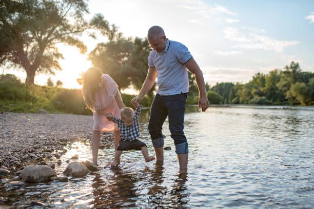 istock Young happy family in the park 1168952190