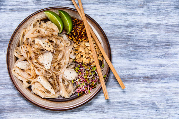 istock Pad thai - chicken meat with noodles and vegetables 1168952239