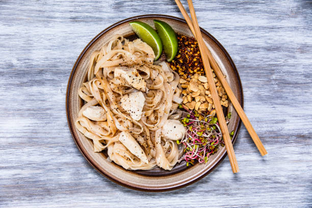 istock Pad thai - chicken meat with noodles and vegetables 1168952360