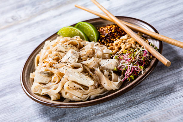 istock Pad thai - chicken meat with noodles and vegetables 1168952668
