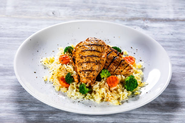 istock Roast chicken filets with rice and vegetables 1168952764