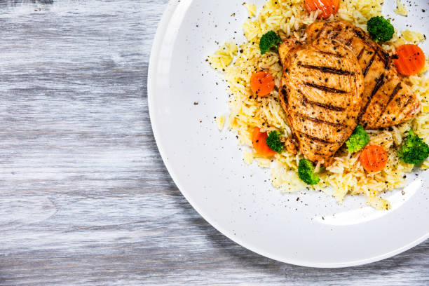 istock Roast chicken filets with rice and vegetables 1168952819