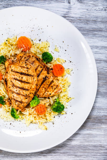 istock Roast chicken filets with rice and vegetables 1168952876