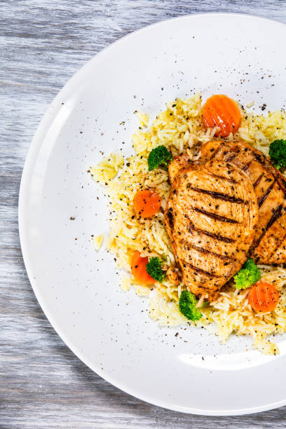 istock Roast chicken filets with rice and vegetables 1168953410
