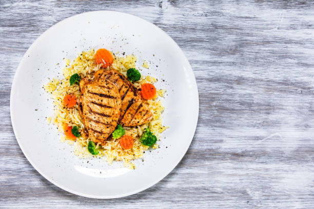 istock Roast chicken filets with rice and vegetables 1168953467